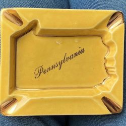 F & M Artware Pennsylvania handmade ceramic ashtray in gold w warranted 22kt. gold accents. 1950s. Base shaped like PA. 4”x3”. Free ship.