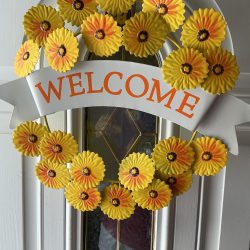 Sunflower “Welcome” Metal Wreath. Sturdy. Bright addition to your front door or anywhere you need a bit of sunshine.18”by 15.”Free shipping.